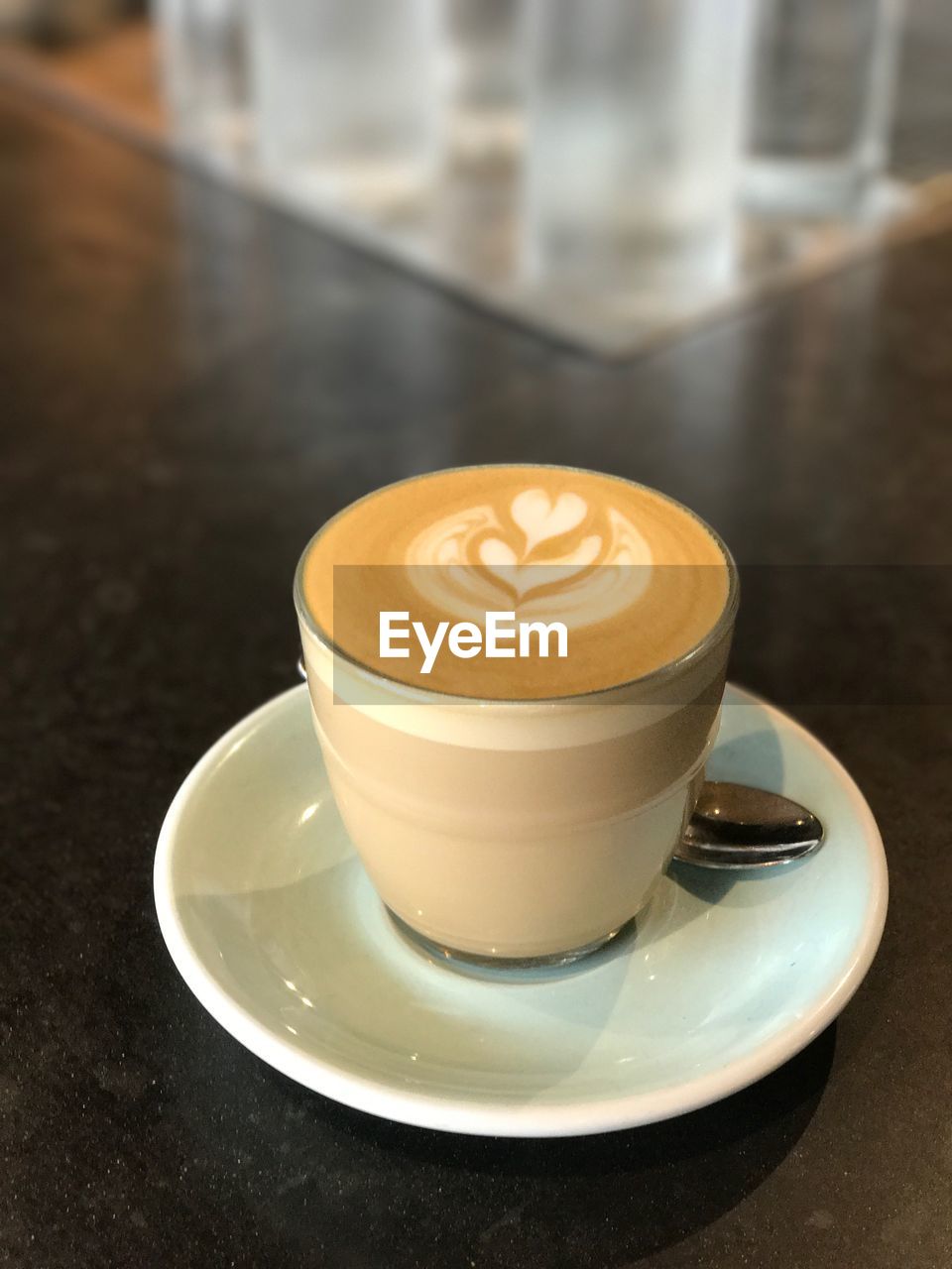 CLOSE-UP OF CAPPUCCINO SERVED ON TABLE