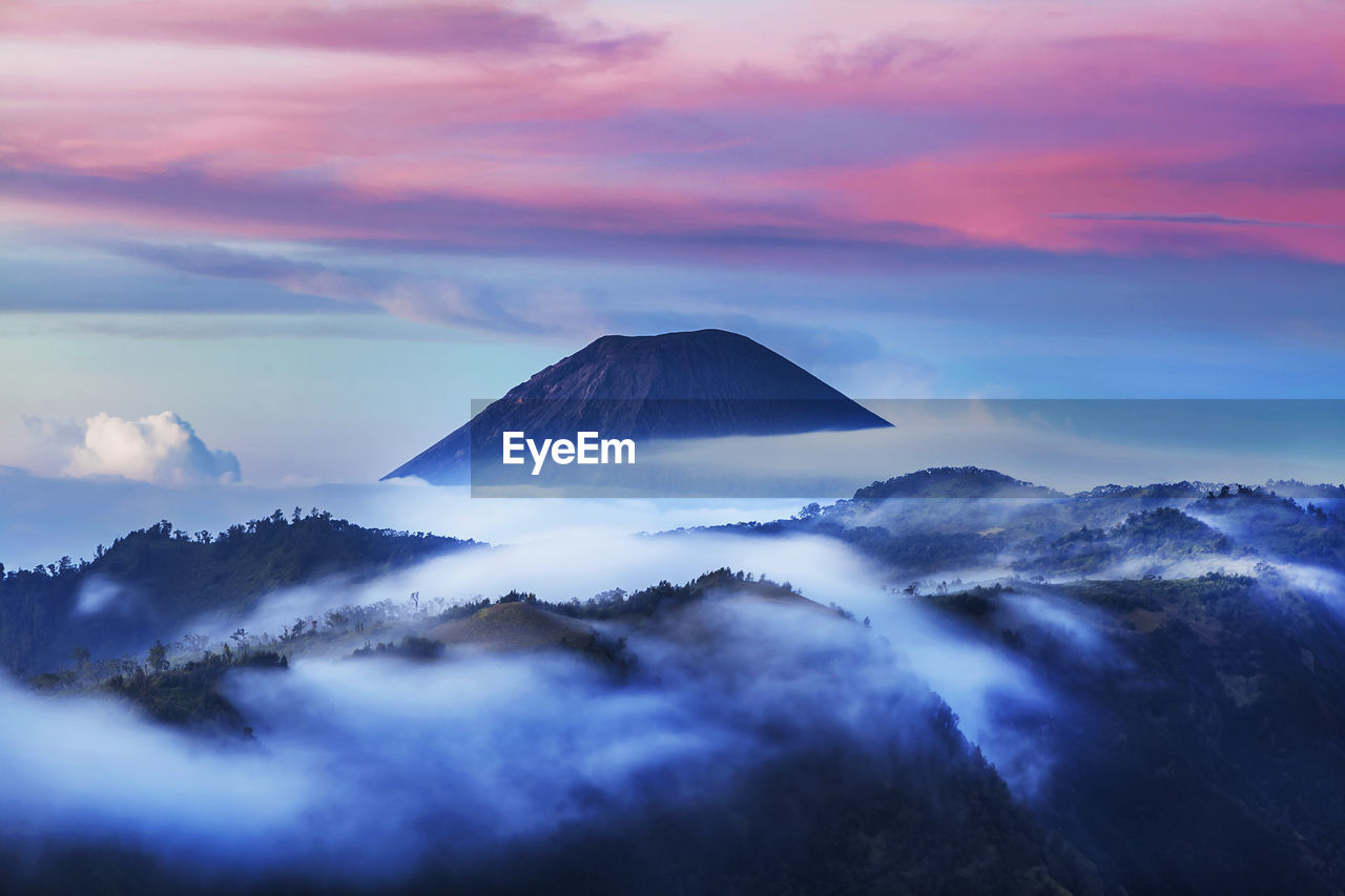 Scenic view of mountains against sky during sunset