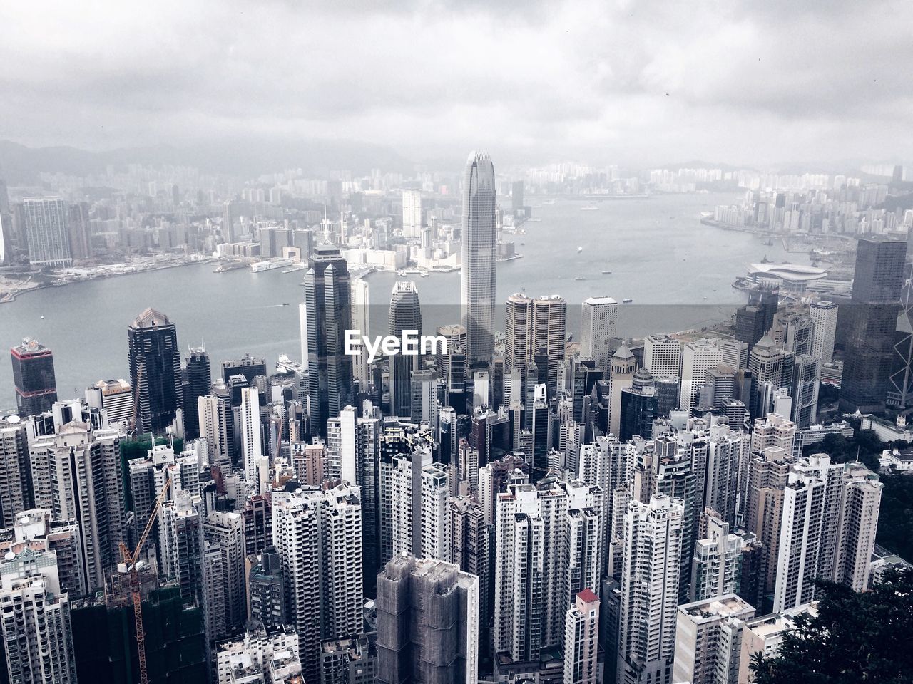 Aerial view of victoria peak against cloudy sky