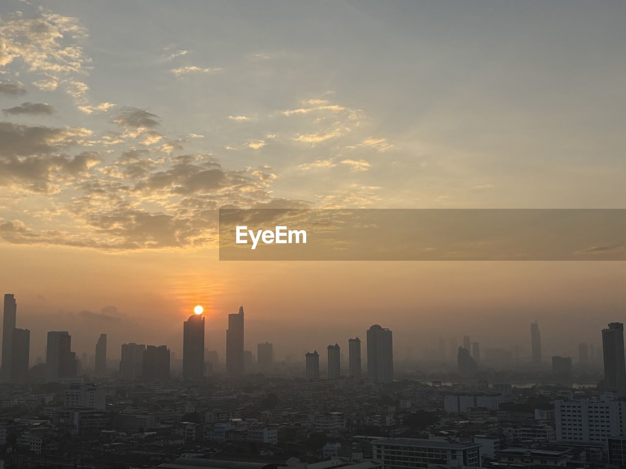 city, architecture, building exterior, sky, built structure, building, cityscape, skyscraper, urban skyline, office building exterior, landscape, horizon, sunset, skyline, nature, cloud, dawn, residential district, city life, travel destinations, sunlight, no people, downtown district, outdoors, fog, metropolitan area, high angle view, development, sun, afterglow, environment, tower, dramatic sky, business, evening, haze, urban area, office, aerial view, travel