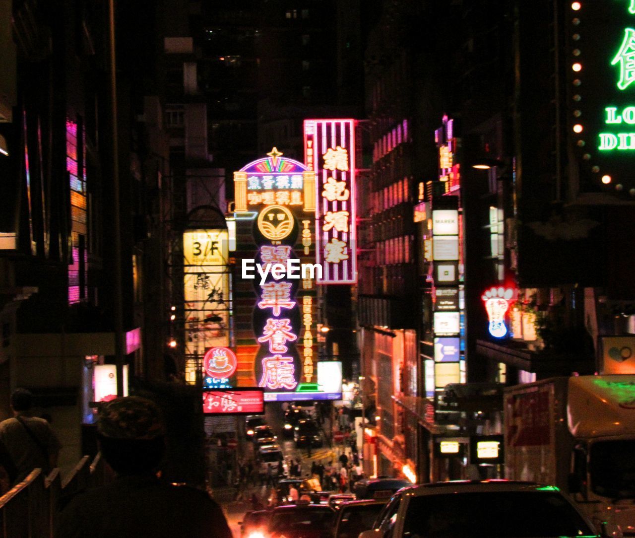 VIEW OF ILLUMINATED CITY AT NIGHT