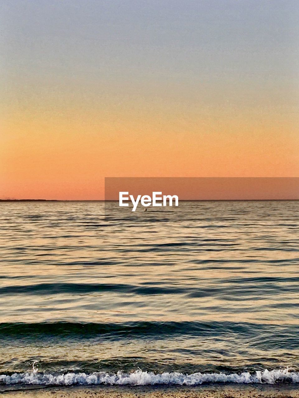VIEW OF SEA AT SUNSET