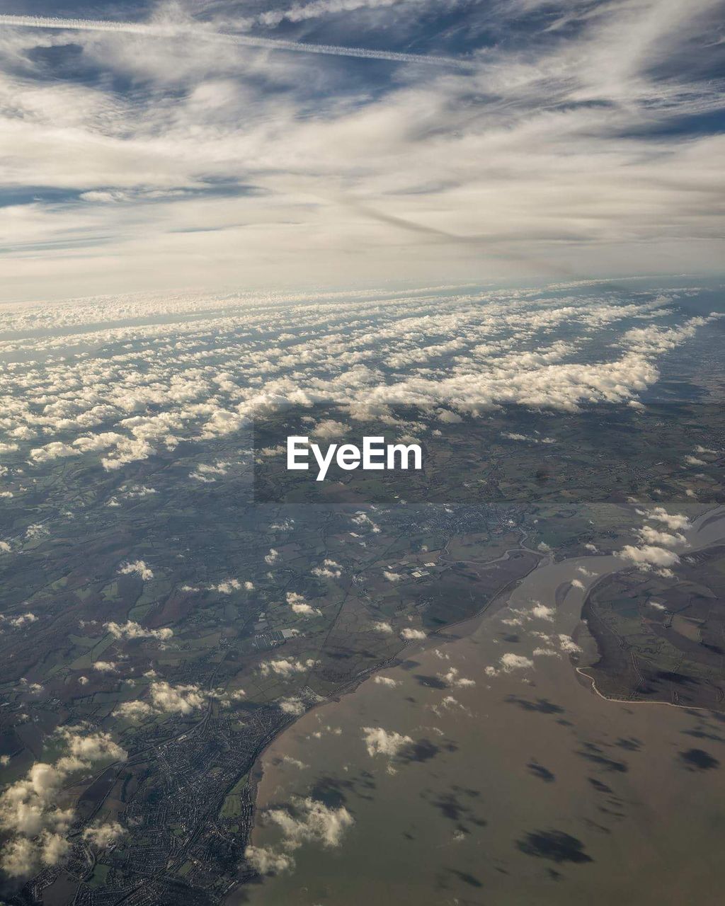 AERIAL VIEW OF CLOUDSCAPE OVER CITY