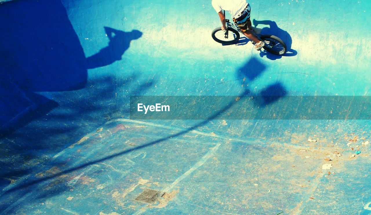 High angle view of man cycling at skateboard park