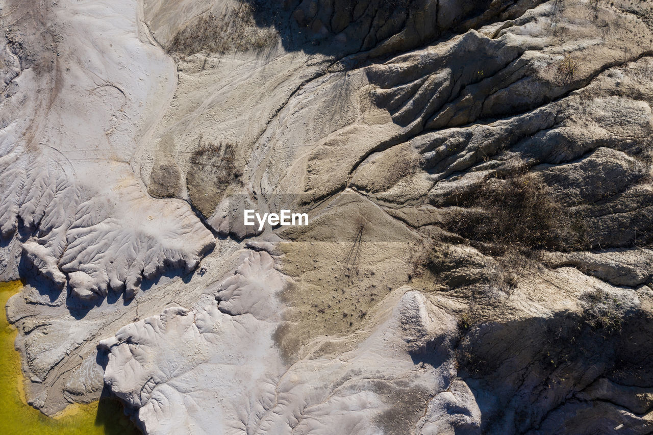 Industrial mining landscape from a drone. aerial view of abandoned open pit mine, nature pollution