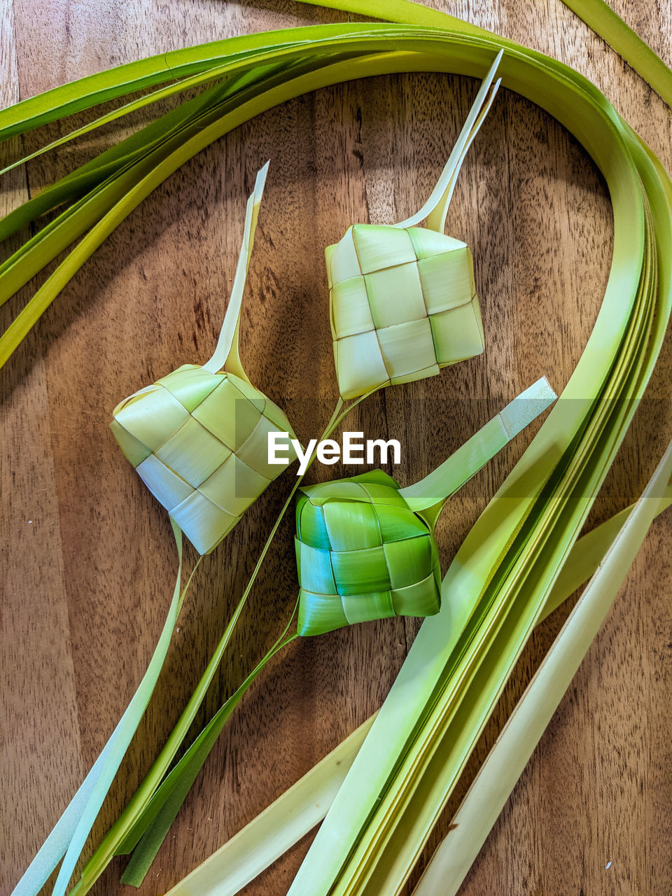 Ketupat is a dish made from rice or glutinous rice wrapped in coconut leaves and boiled in a pot