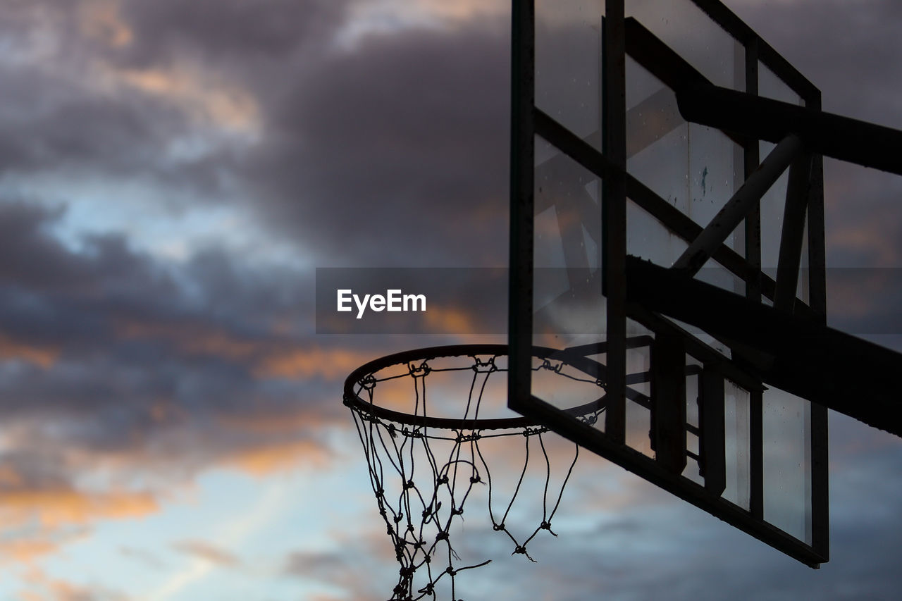 Low angle view of basketball hoop against sky