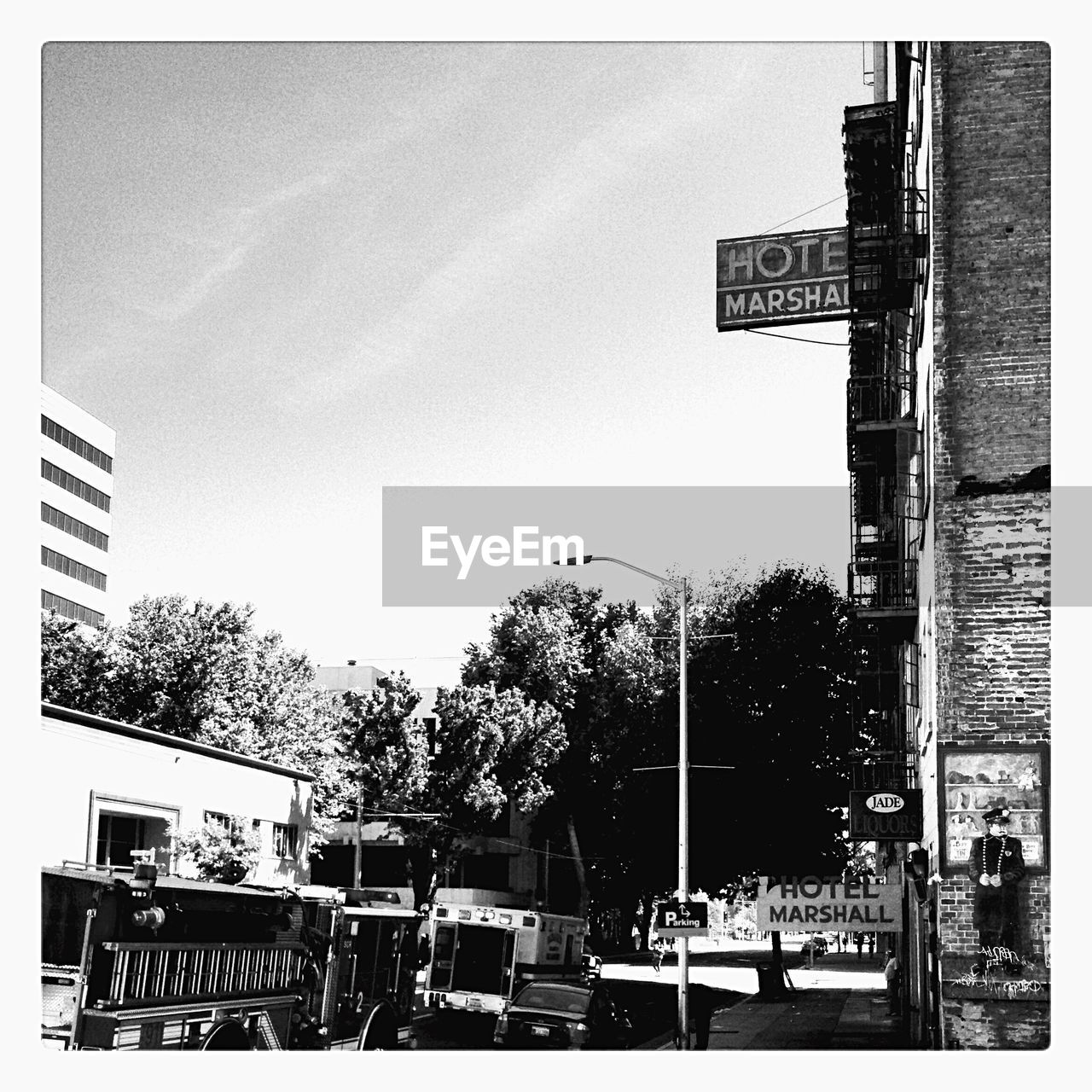 ROAD SIGN IN FRONT OF BUILDING