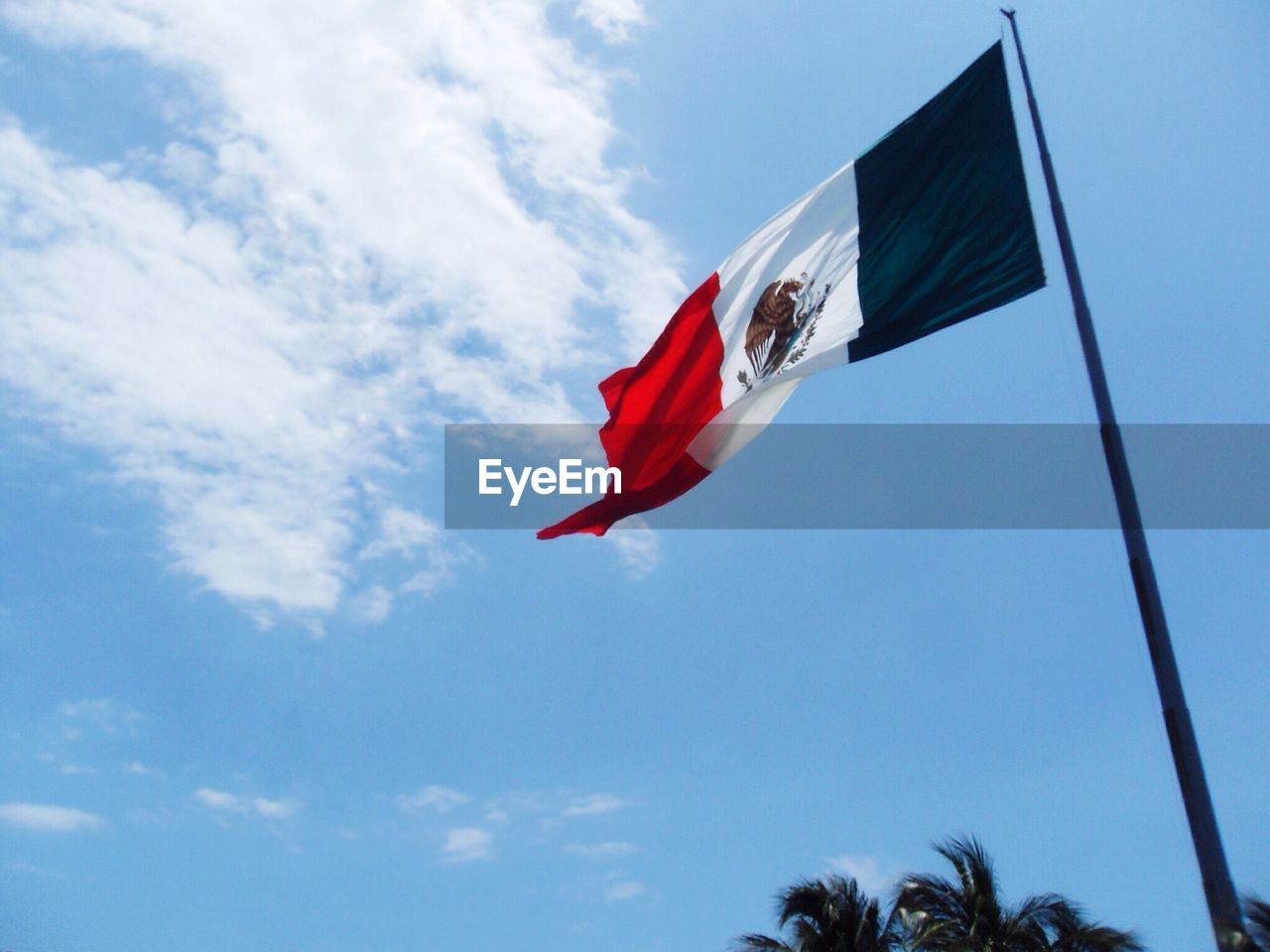 Low angle view of flag against sky