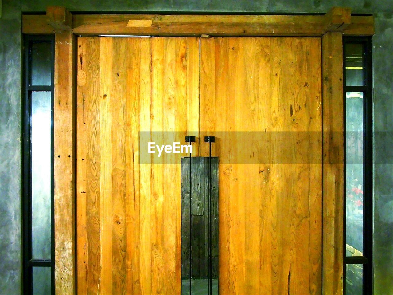 CLOSED WOODEN DOOR OF BUILDING