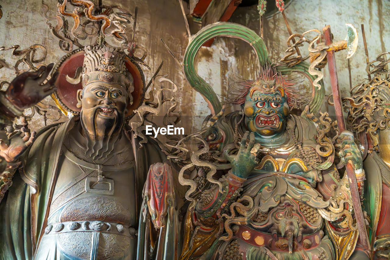 religion, belief, spirituality, representation, human representation, temple, sculpture, ancient history, architecture, no people, craft, male likeness, place of worship, temple - building, tradition, creativity, statue, art, building, history, built structure, indoors, close-up, the past