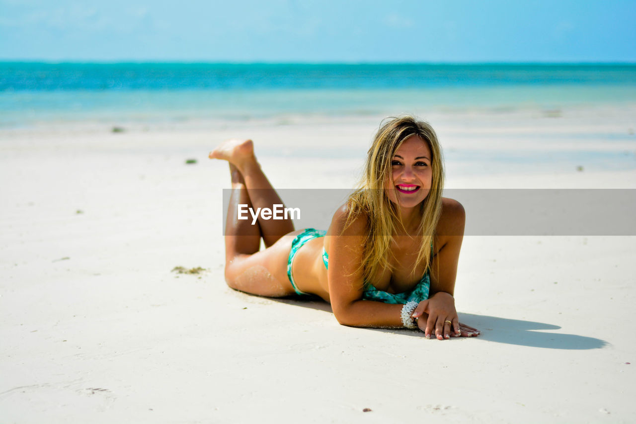 Beautiful young woman on beach