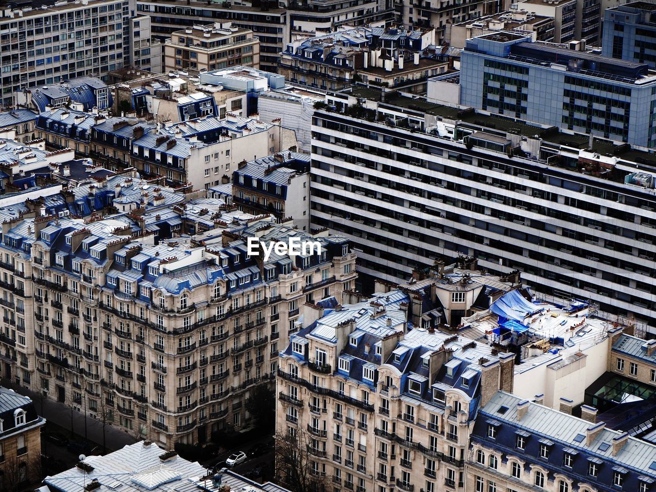HIGH ANGLE VIEW OF BUILDINGS IN CITY DURING WINTER