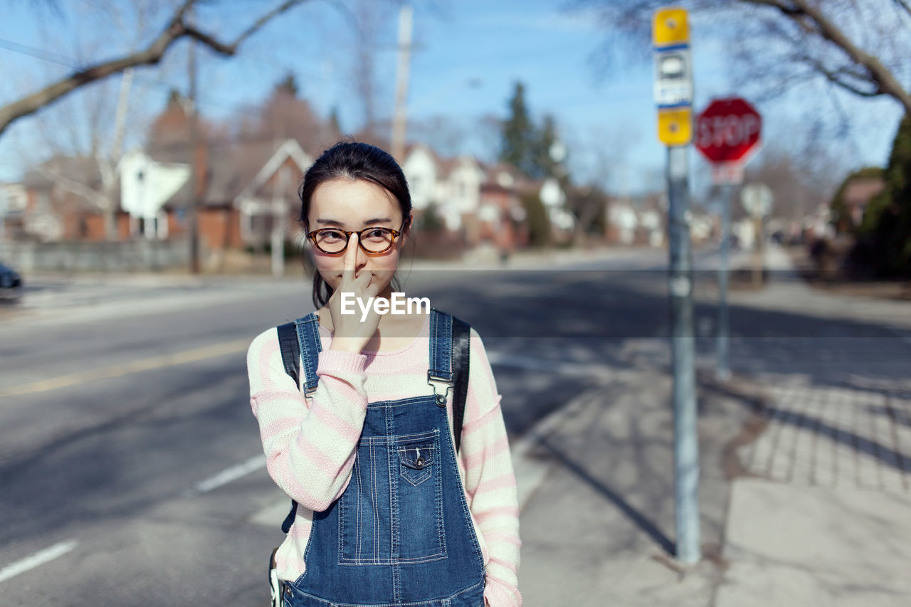 Woman standing on street