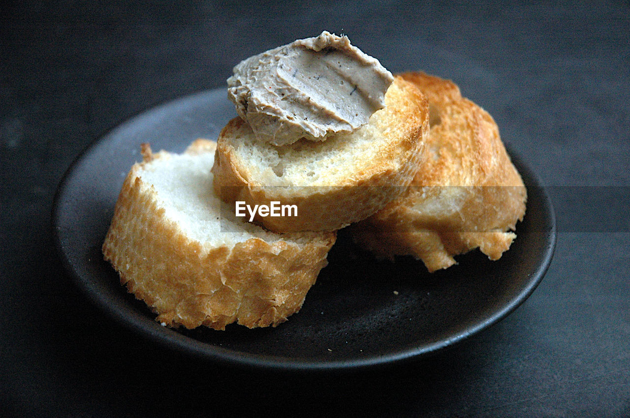 High angle view of pate on toast in plate