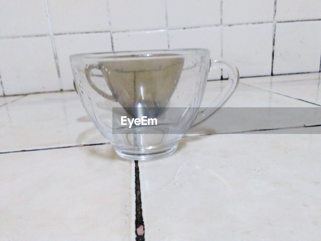 CLOSE-UP OF WINEGLASS ON TABLE