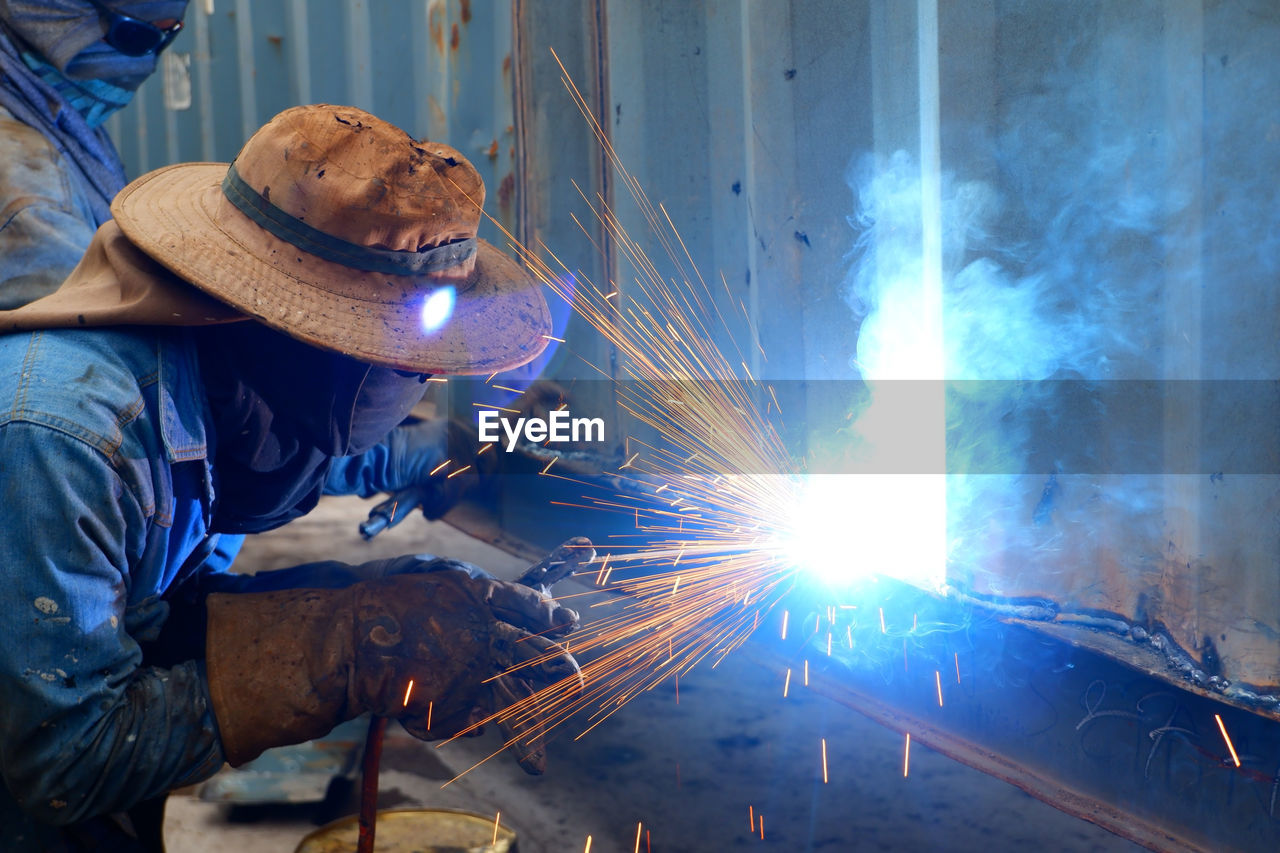 Men working on metal in workshop