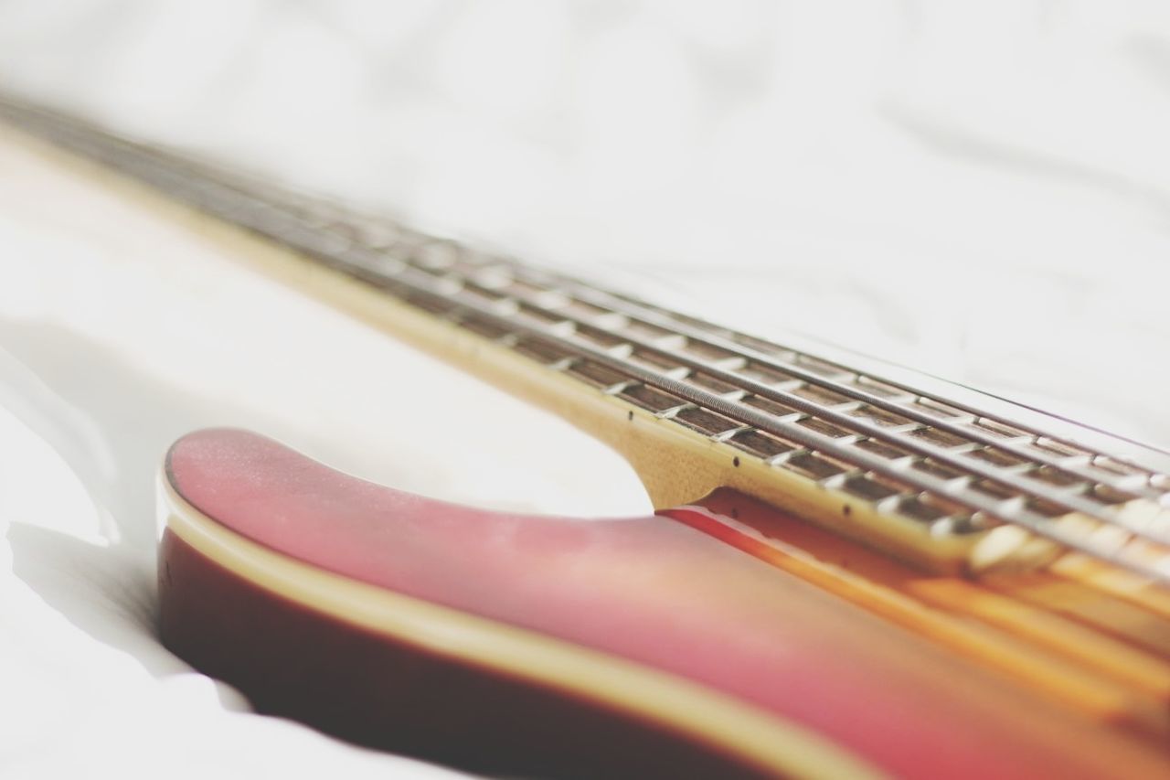 CLOSE-UP VIEW OF GUITAR AND PIANO