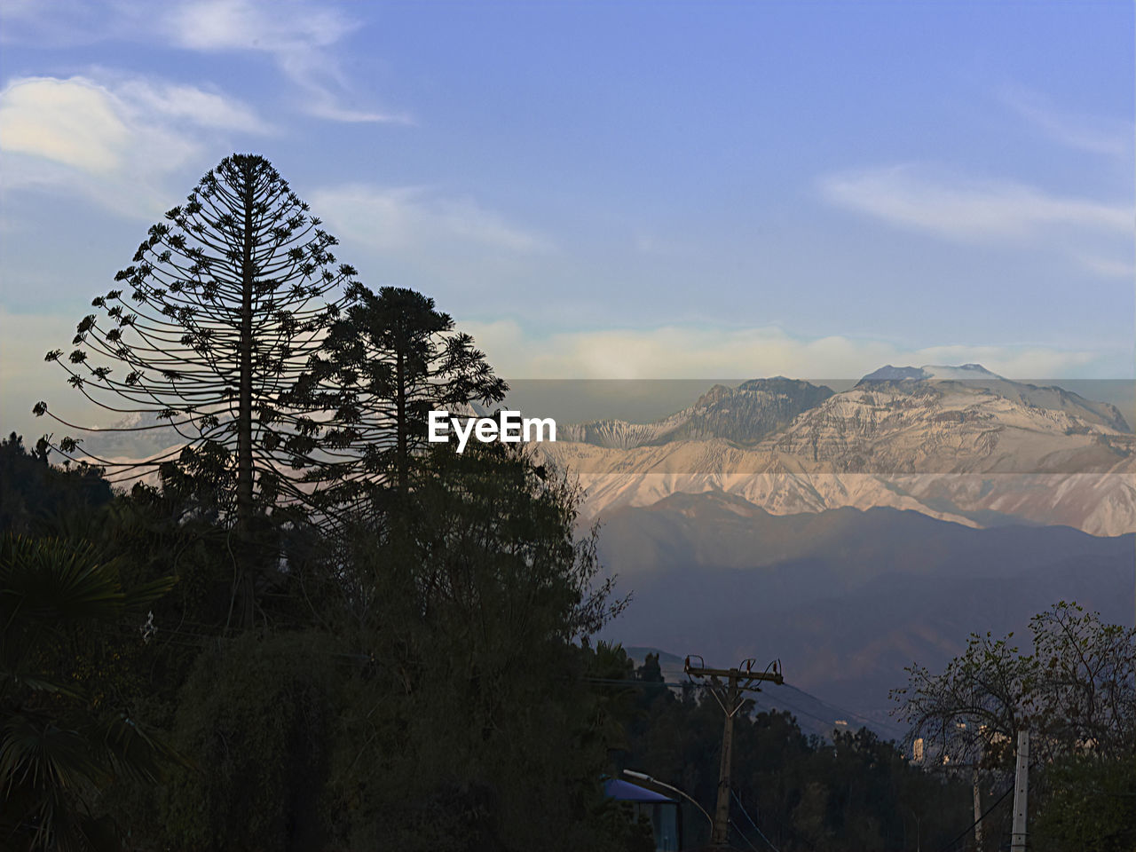 mountain, sky, nature, mountain range, scenics - nature, tree, beauty in nature, environment, landscape, plant, cloud, travel destinations, snow, travel, wilderness, mountain peak, land, no people, tourism, snowcapped mountain, tranquility, winter, outdoors, architecture, cold temperature, tranquil scene, pinaceae, forest, coniferous tree, pine tree, morning, non-urban scene, holiday, vacation