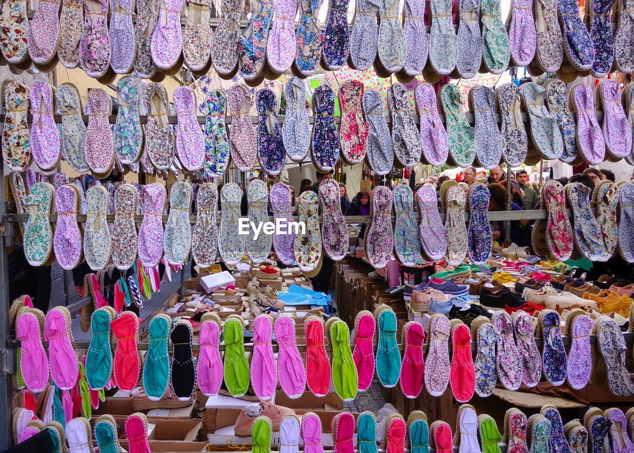 Full frame shot of multi colored shoes for sale in market