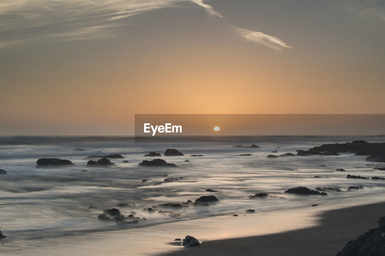 Scenic view of sea against sky during sunset