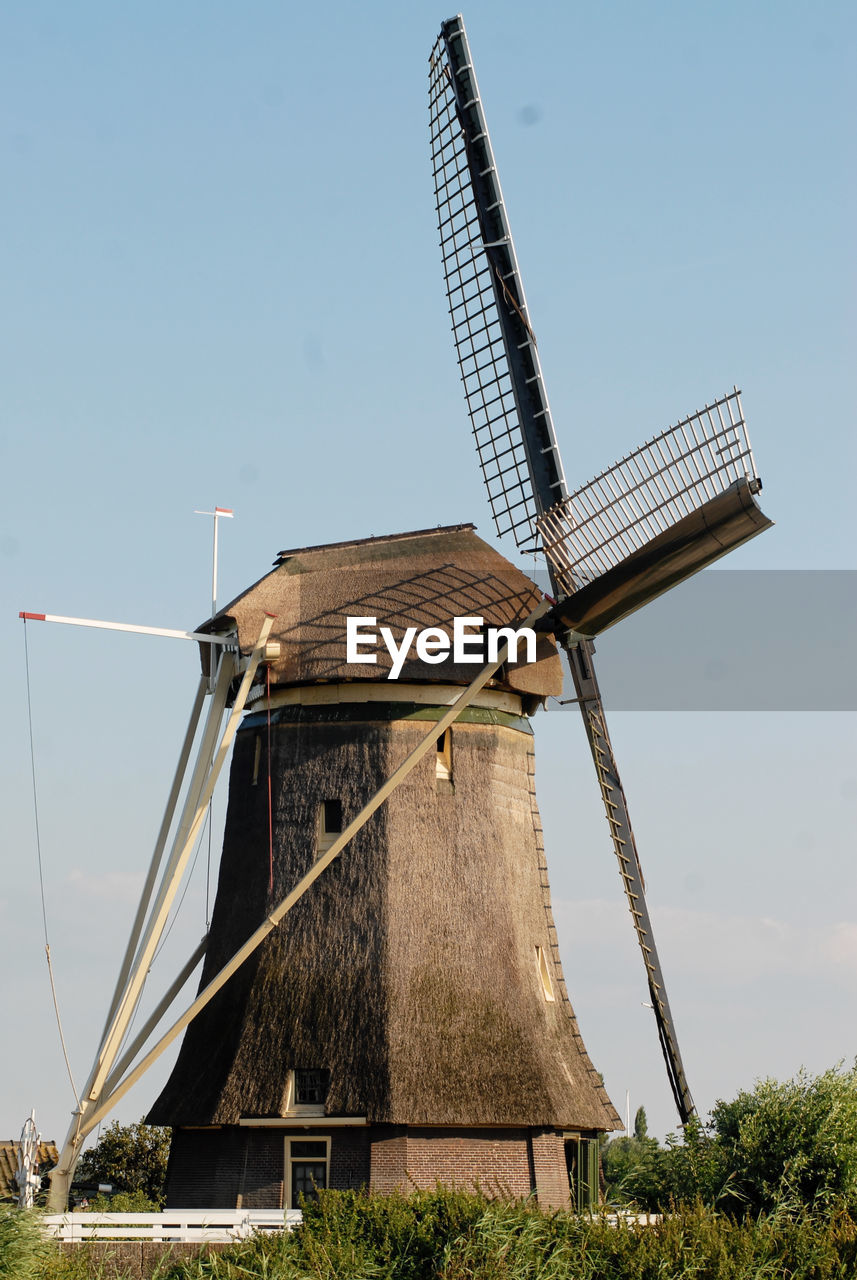 Traditional windmill against clear sky