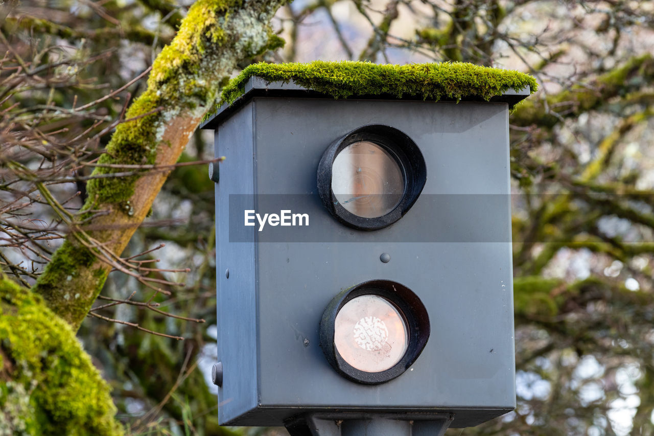 Close-up of old speed measuring device with moss on the roof in monschau