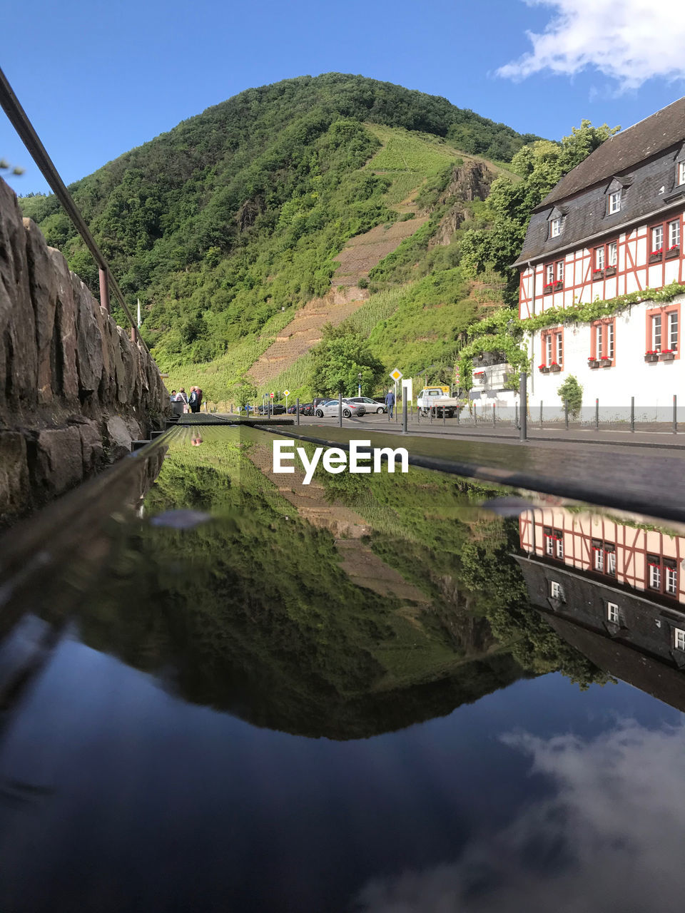 RIVER AMIDST BUILDINGS AGAINST SKY