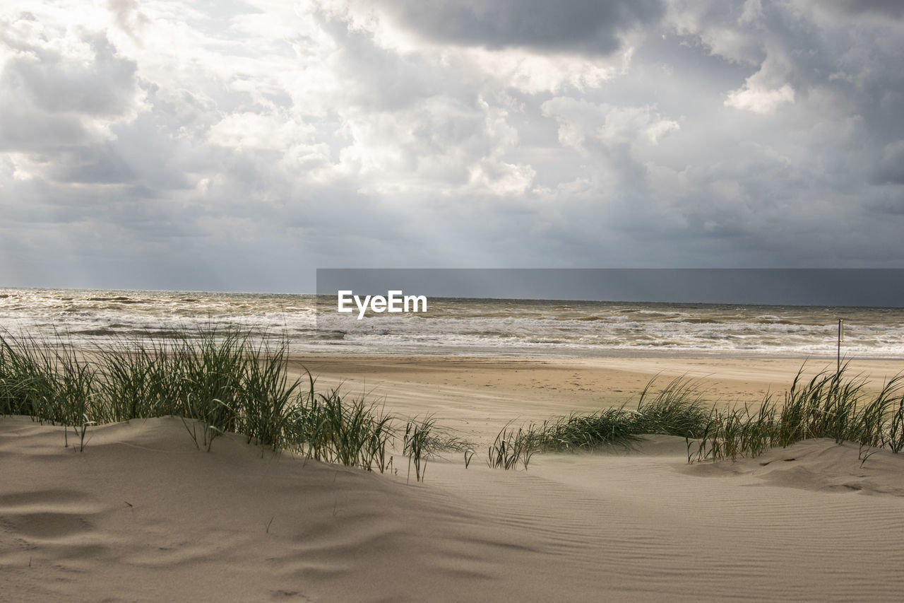 Scenic view of beach against sky