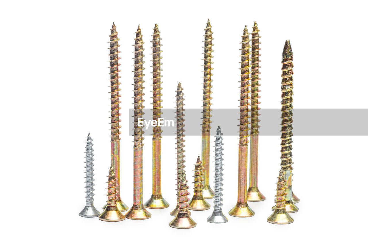 white background, cut out, studio shot, large group of objects, no people, indoors, in a row, metal, group of objects, order, arrangement, variation, gold, earring, close-up