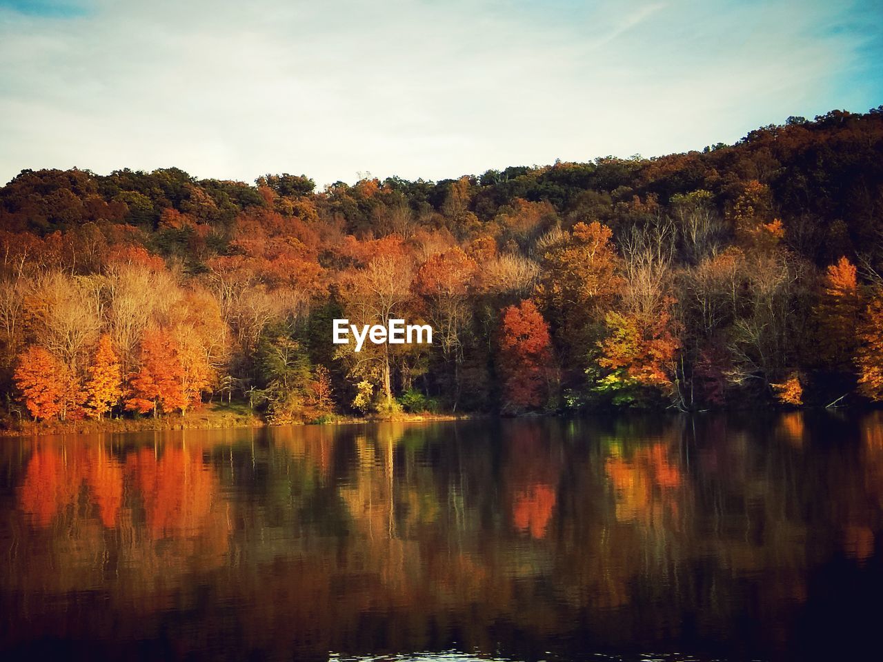 Scenic view of lake against sky during autumn