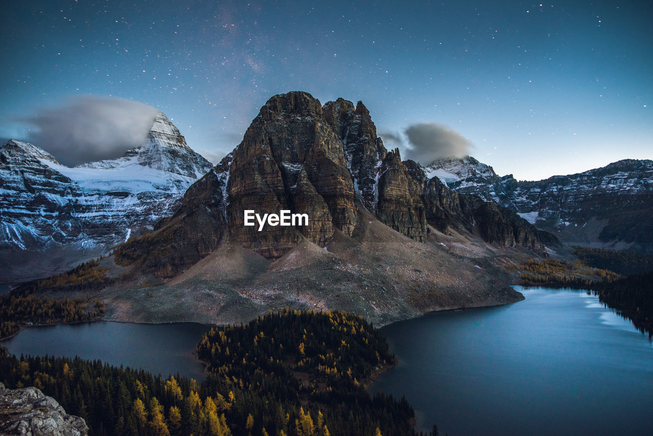 Panoramic view of sunburst peaks and mount assiniboine at night