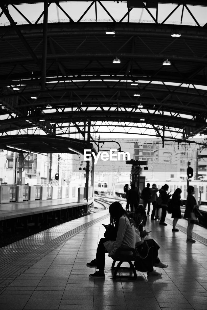 People at railroad station platform