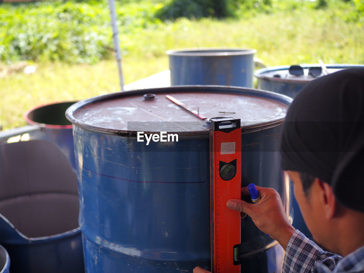 Close-up of man measuring barrel