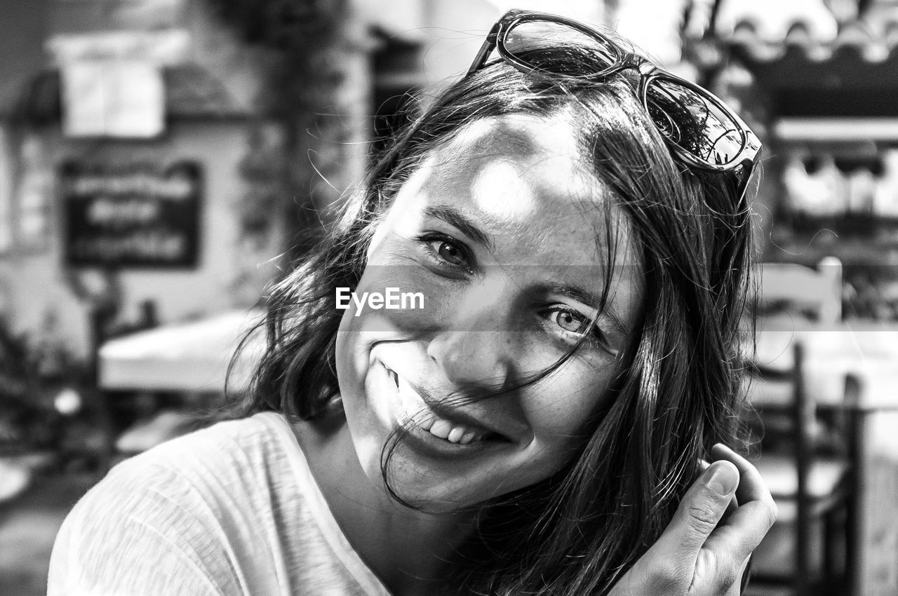 Close-up portrait of a smiling young woman