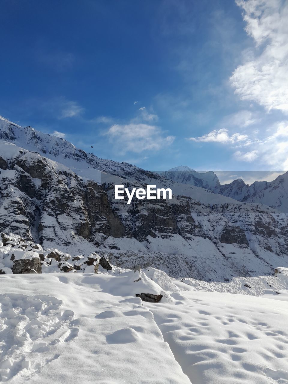 scenic view of snow covered mountains against sky