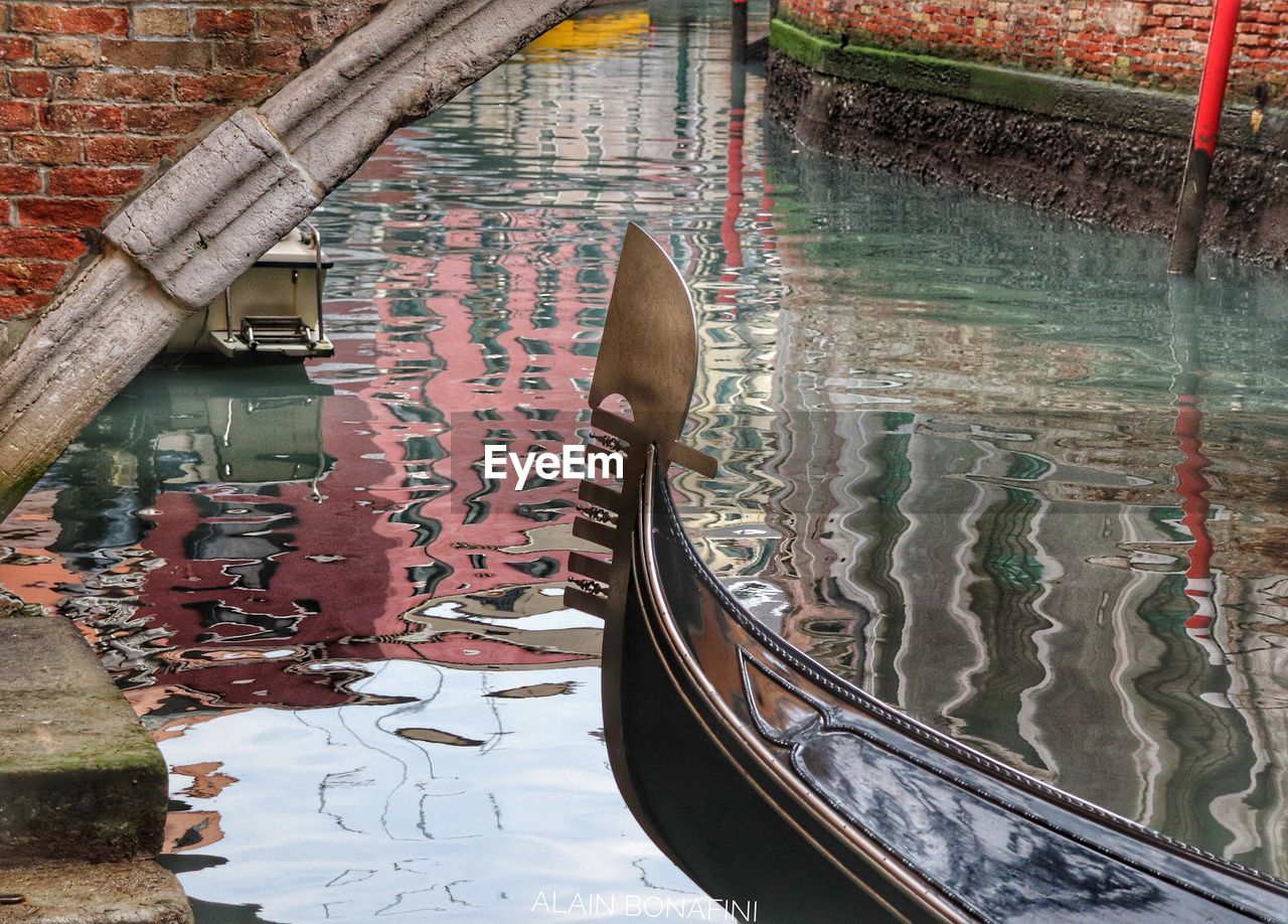 High angle view of canal amidst buildings