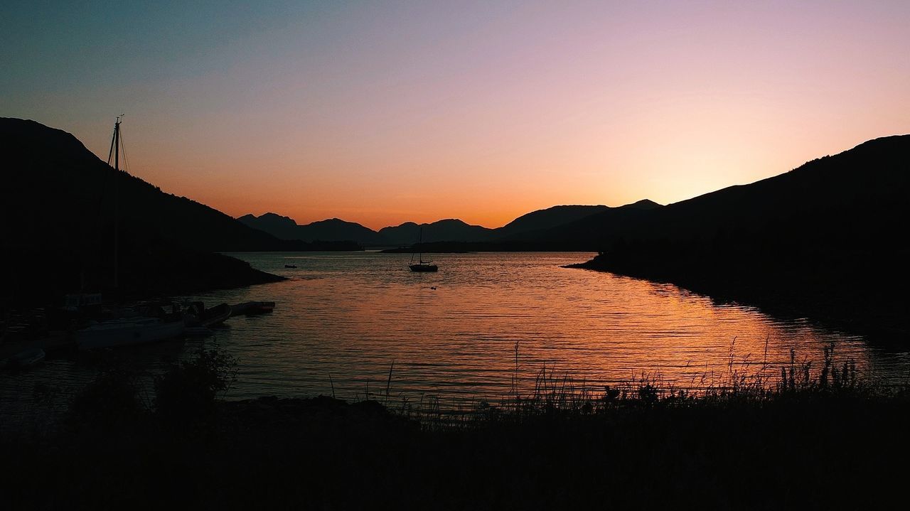 Scenic view of river at dusk