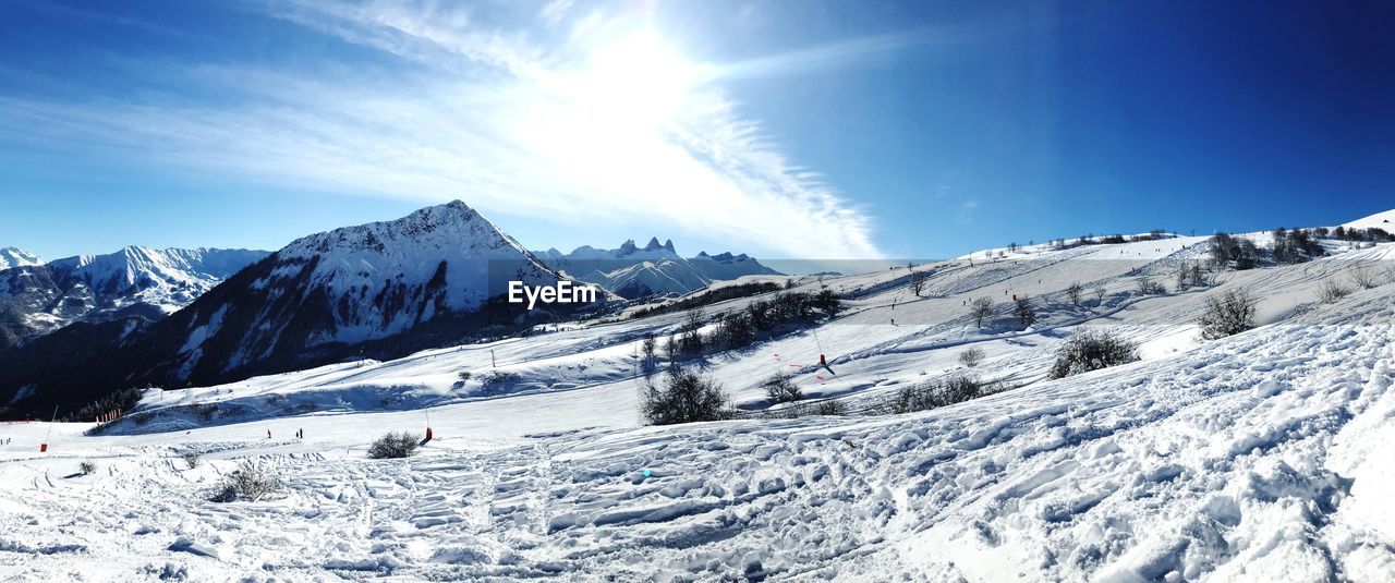 Scenic view of snowcapped mountains against sky