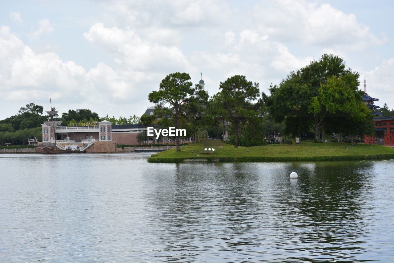 LAKE AND BUILDINGS AGAINST SKY