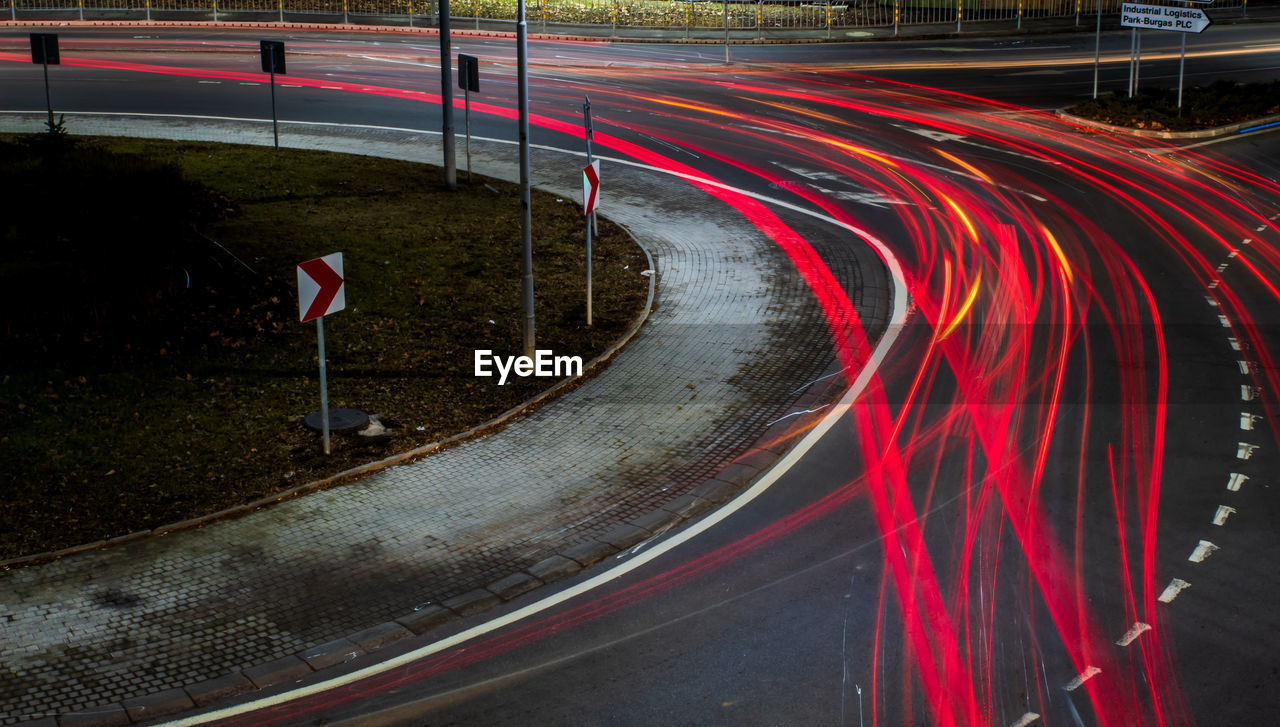 Light trails on road in city at night