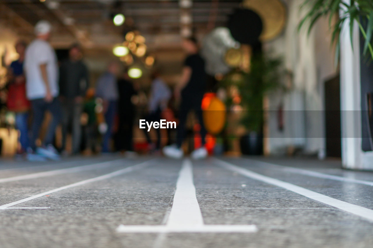 Surface level of people on street in hallway