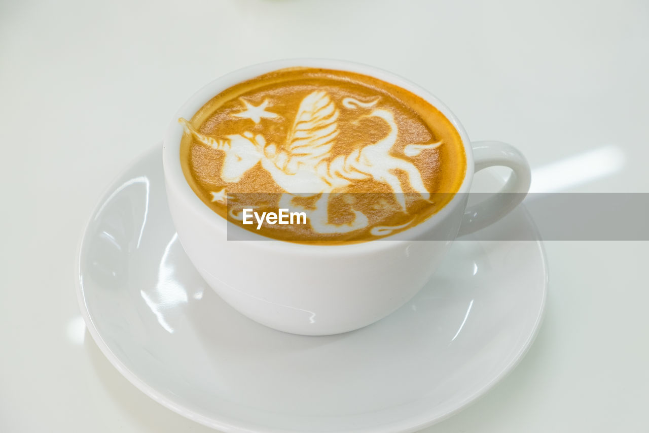 A cup of latte art in coffee shop