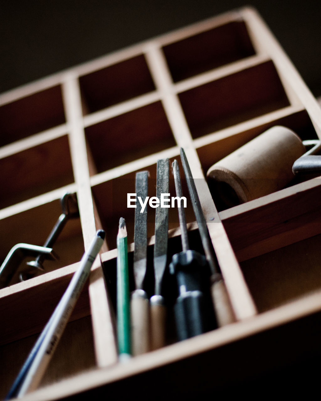 Close-up of work tools in container