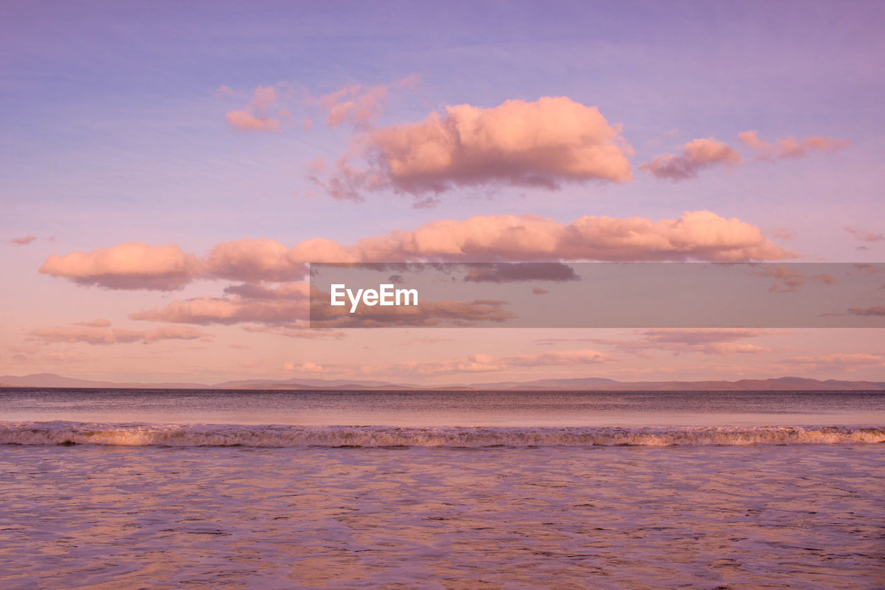 Scenic view of calm sea at sunset