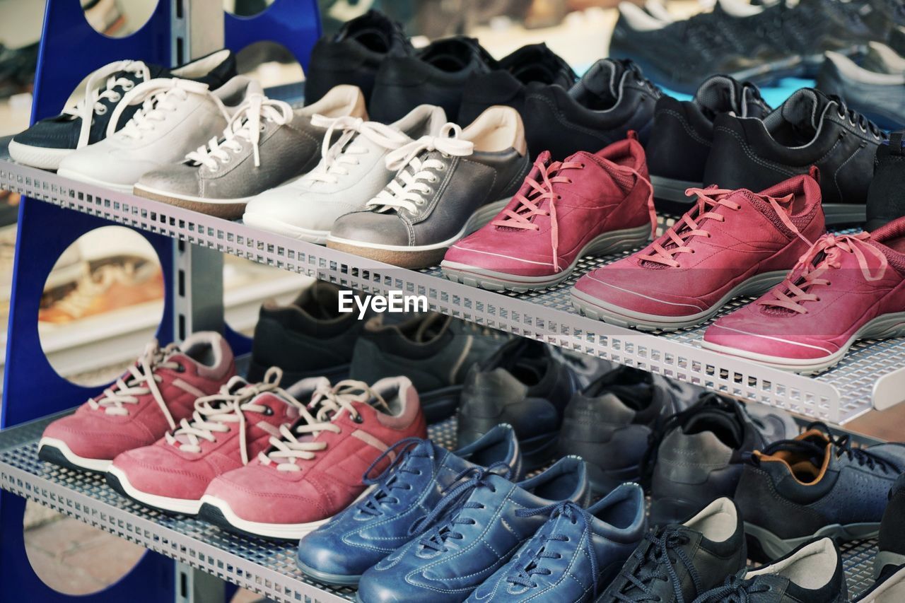 High angle view of shoes on shelves in store