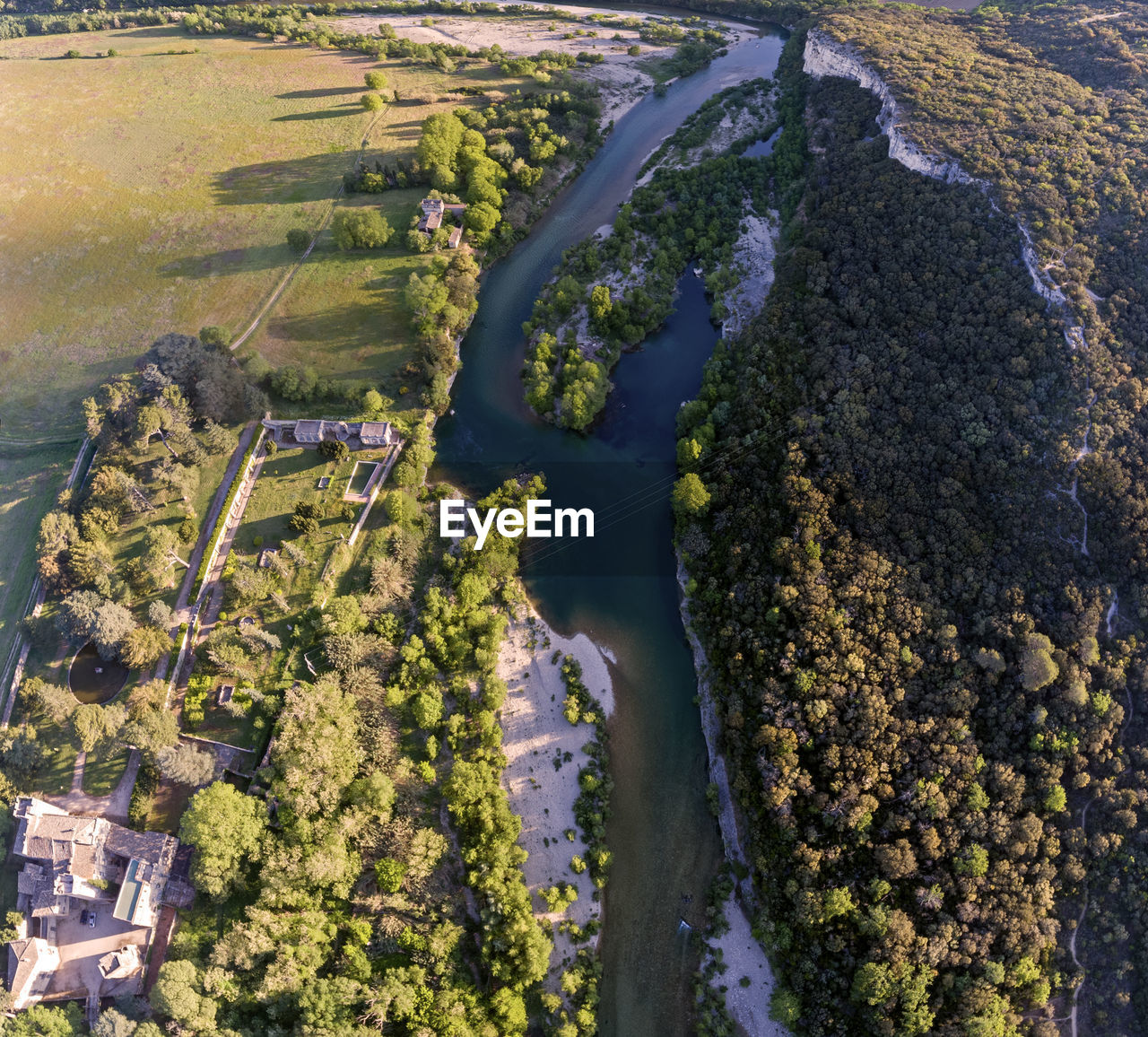 High angle view of river amidst trees in city