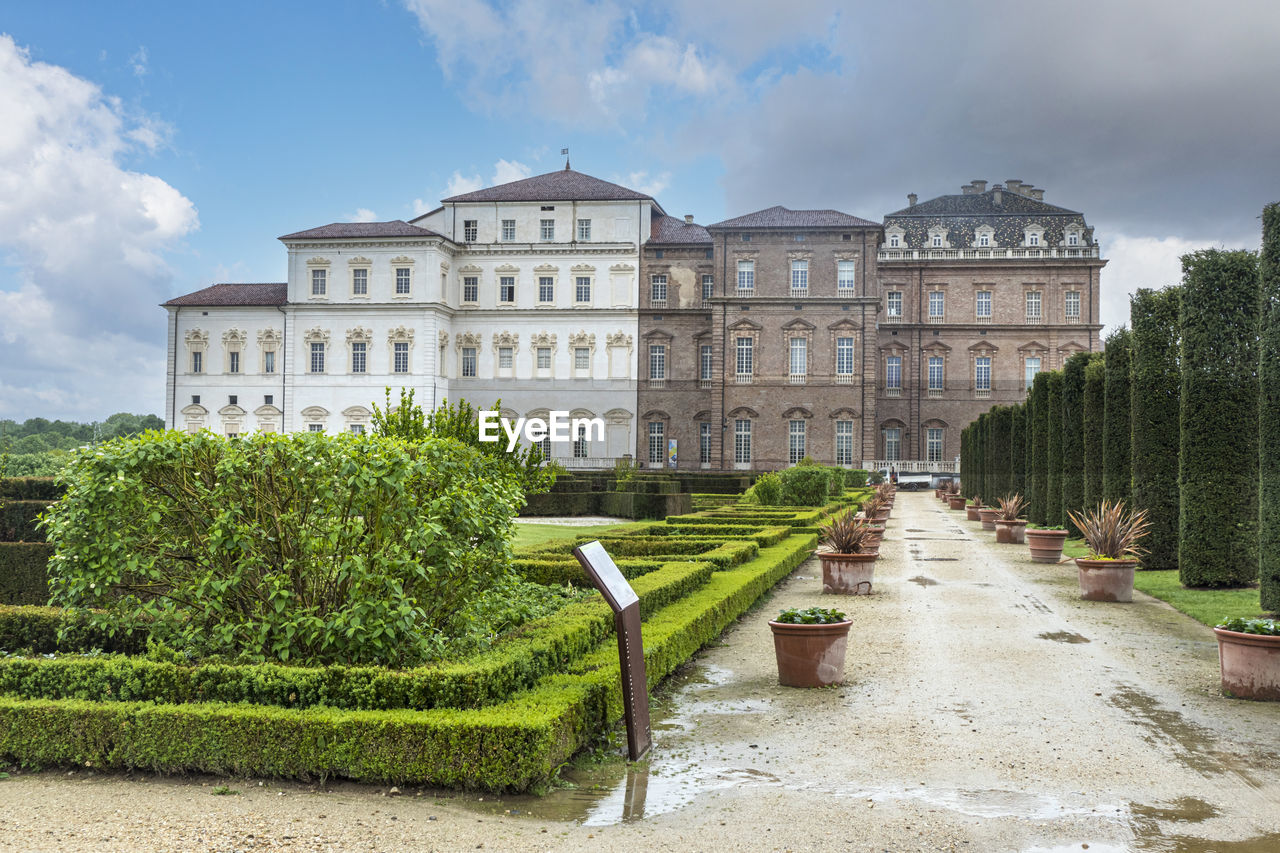 The beautiful facade and gardens of the reggia dei savoia in the venaria reale