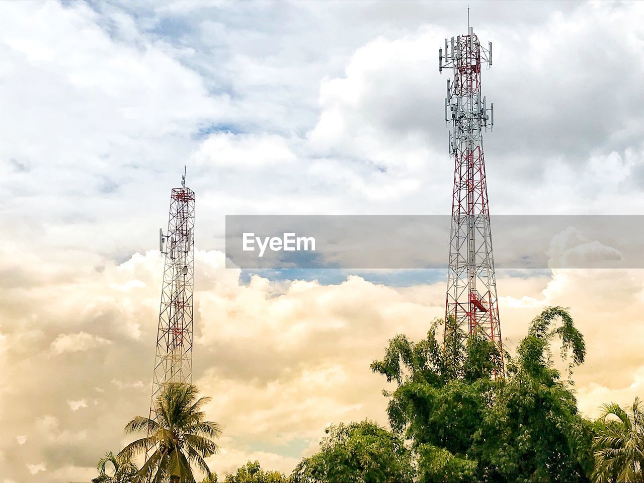 Low angle view of communications tower against sky