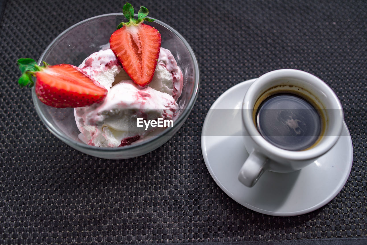 A cup of coffee with some strawberry on different background